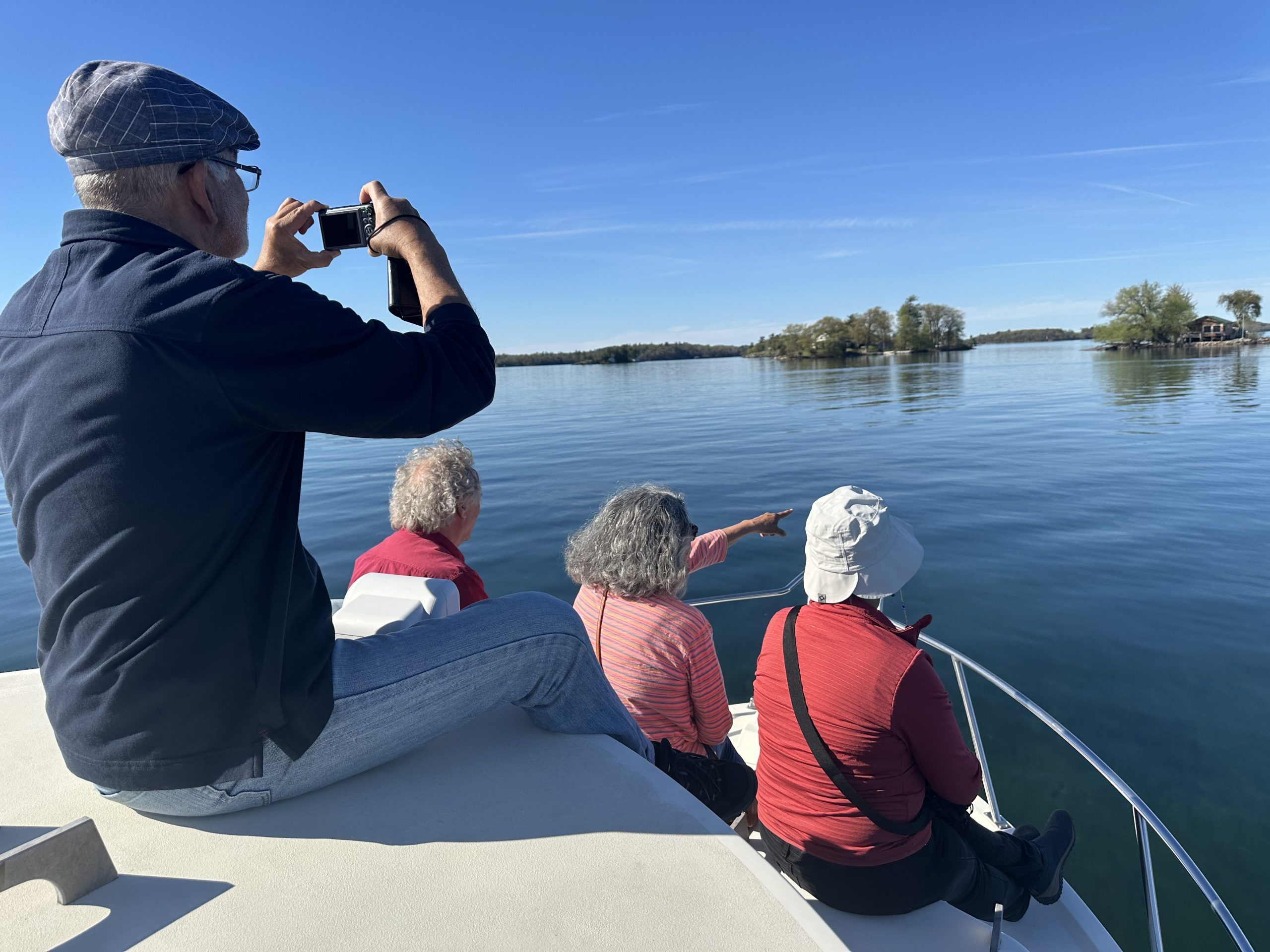 Four happy customers sightseeing with 1000 Islands Water Tours